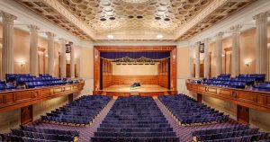 Stambaugh Auditorium main concert hall with fabric seats and large wooden stage